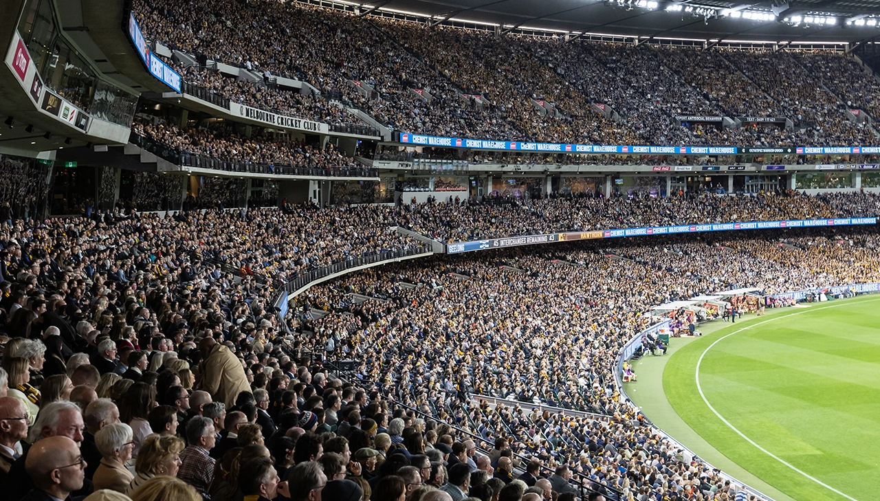 The crowd fills the MCC Members' Reserve at the MCG during a night game
