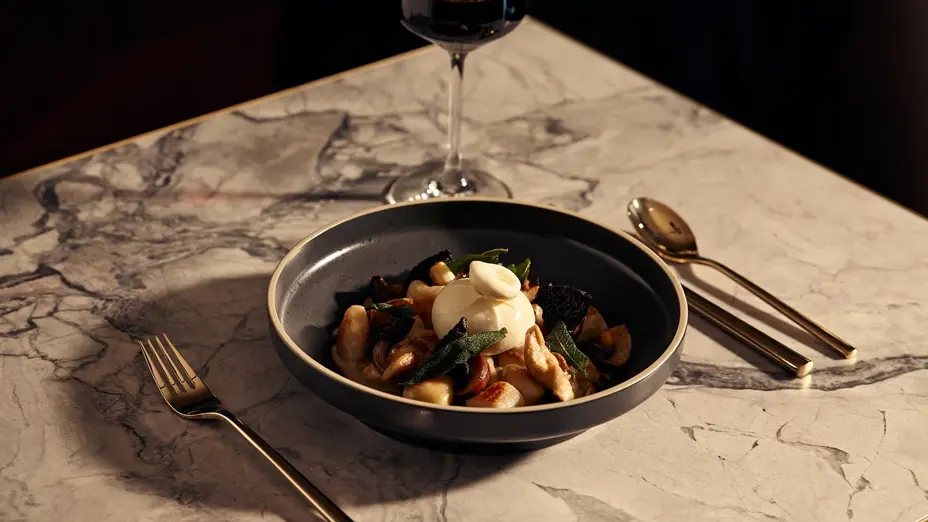 Gnocchi with sage and burrata styled with red wine