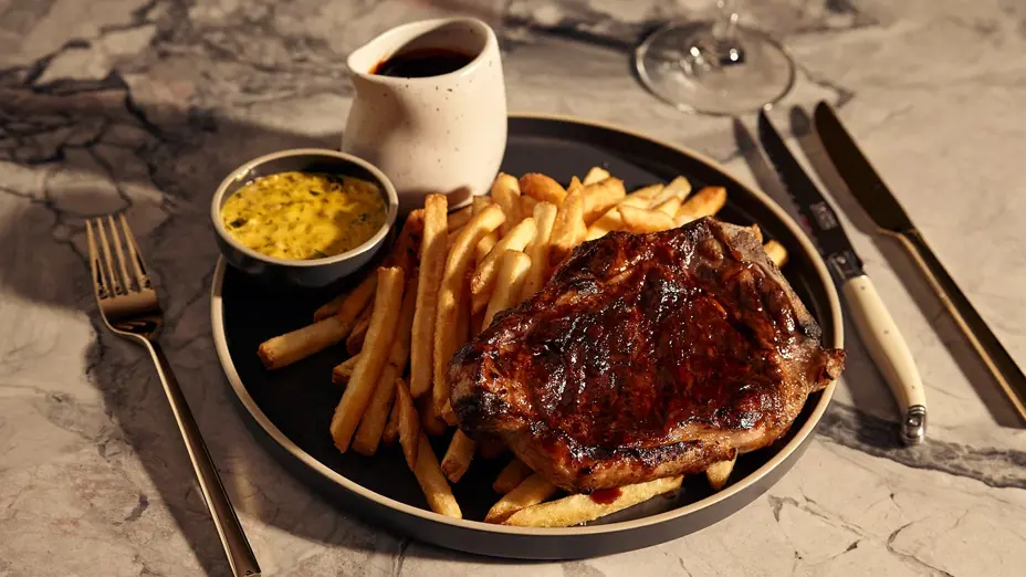 Restaurant styled steak, fries and sauce