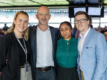 Four people in attire that meets the MCC dress standard with collared shirts or blouses
