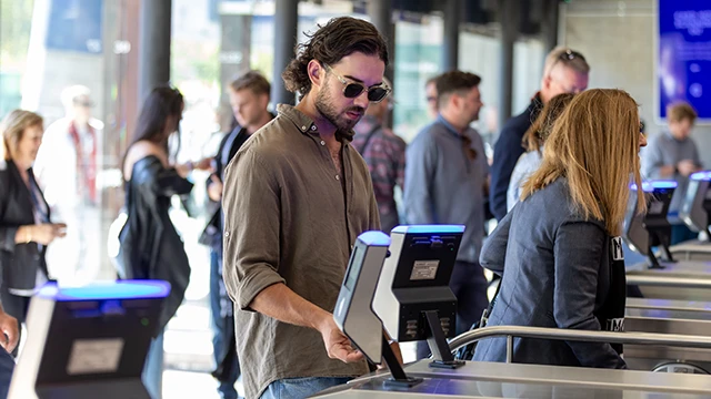 Patron scans in Gate 2 turnstile
