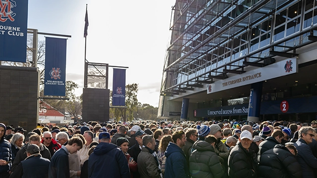 MCC members queue outside Gate 2 of the MCG