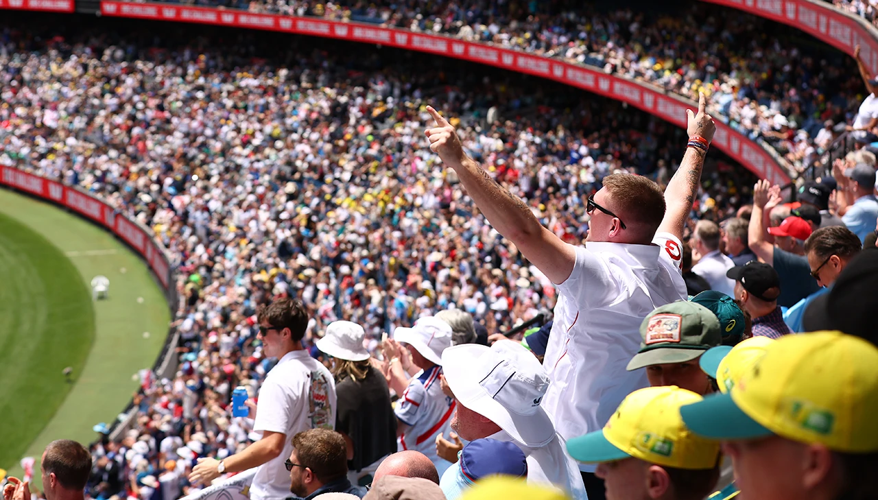England cricket fans celebrate in the stands at the Boxing Day Test