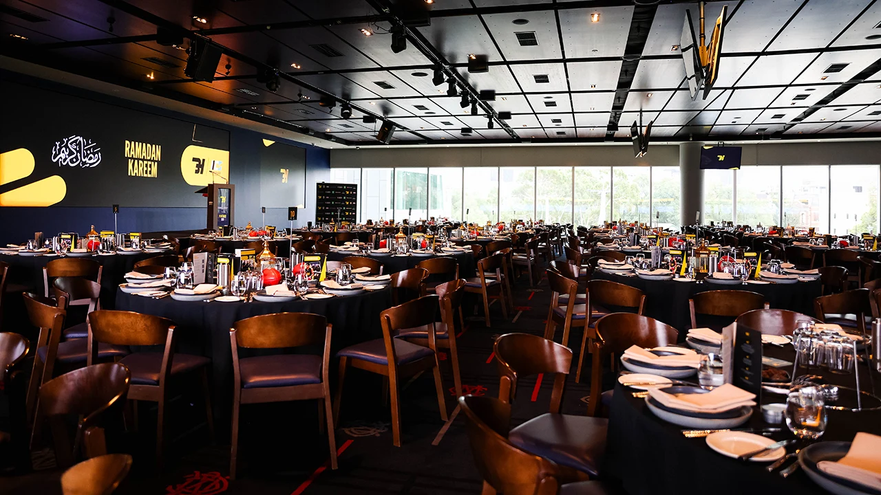 Large function space with tables and 'Ramadan Kareem' message