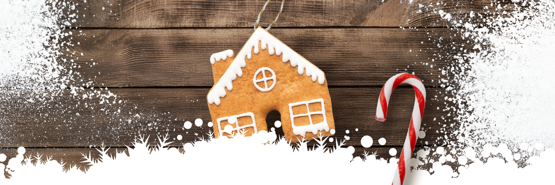 A gingerbread house on a wooden background