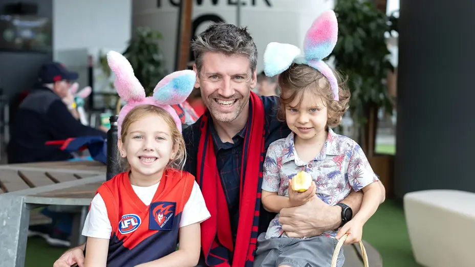 Young family dressed up for footy and Easter