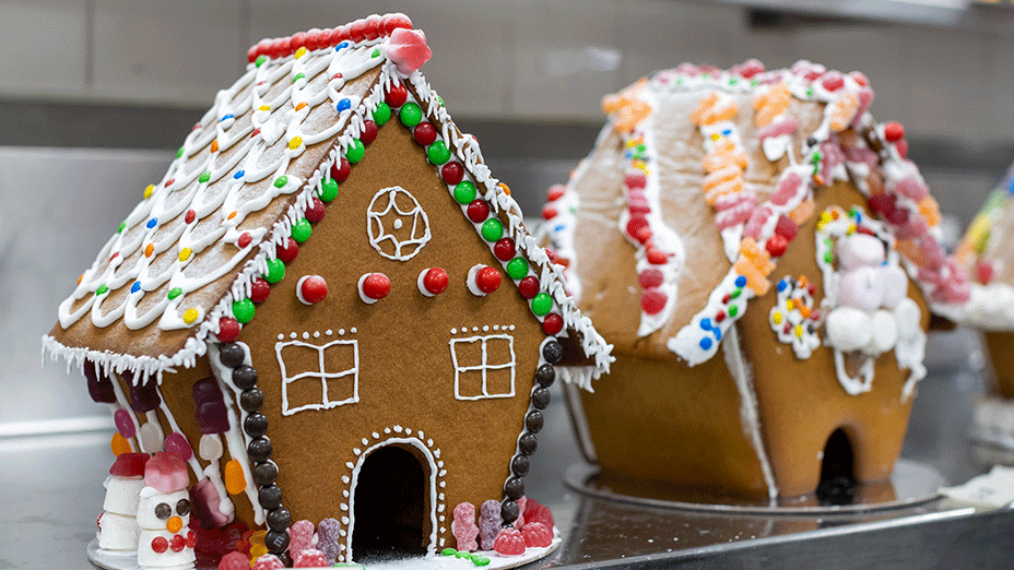 Decorated gingerbread houses covered in icing and lollies